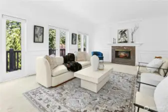 Spacious living room with peaceful view overlooking lush greenery.