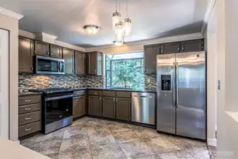 The kitchen, new dishwasher, range and microwave.