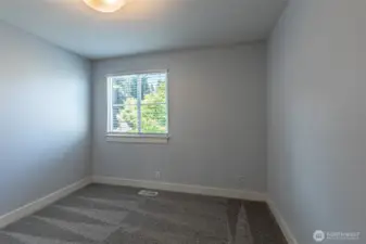 One of three bedrooms on the main floor.