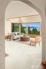 Archway between dining room and living room adds character and interest. Gorgeous hardwood floors in the dining room and kitchen.