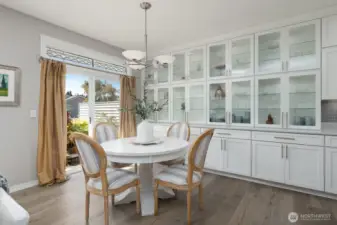 DINING WITH WALL OF CUSTOM CABINETS