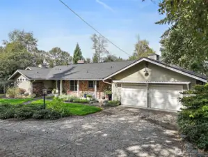 Beautifully updated, three bedroom, 3.25 bath daylight basement home with circular driveway. Nestled among mature trees and in a quiet neighborhood with access from the property to Lake Geneva.  In 2024 a new composition roof was put on, the exterior was painted in 2021 and new lights were added.