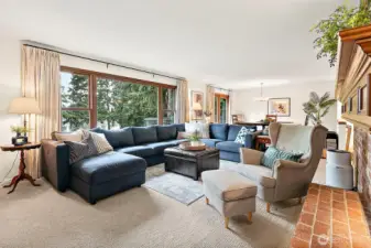 The expansive picture windows beautifully capture serene views of the lake, filling the home with natural light and creating a seamless connection between the indoors and the stunning outdoor setting.  This home has a large living and dining room with an open layout, perfect for large gatherings or everyday living.