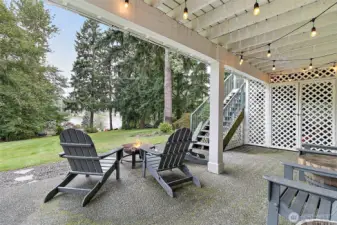 Lower level patio with direct access to the lake.  This property is completely fenced and private.