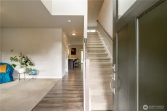 Step inside to find soaring ceilings, bright natural light, & inviting flow, drawing you in.