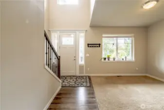 Facing the front door, the Living room is a Versatile Bonus space Bursting w/Natural Light