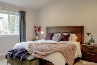 Vaulted Primary is on the back of the home, looking out onto the backyard.