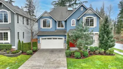 Exquisite landscaping and desirable private corner lot make this home a coveted Sammamish residence.