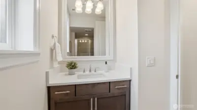 Main level three-quarter bath adjacent to possible 5th bedroom.