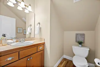 1/2 bathroom off entryway hallway
