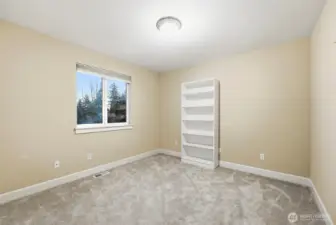 Bedroom 2 upstairs with wall-to-wall carpeted flooring.
