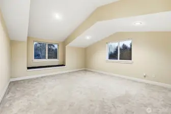 Large upstairs bonus room above garage.