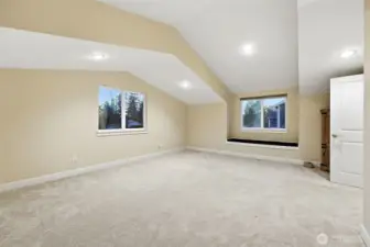 Large upstairs bonus room above garage.