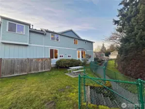 Follow the walking path just out front leading to the Community park the neighbors the property. Has metal picnic table and athletic court with basketball hoop.
