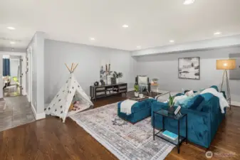 Flexible lower level with heated floors & ample storage