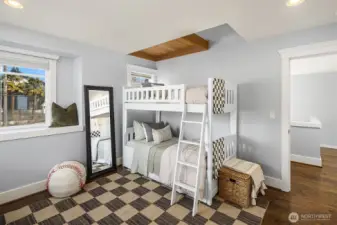 First upstairs bedroom, with loft + corner window with bench; and peek-a-boo views of Mt. Rainier!
