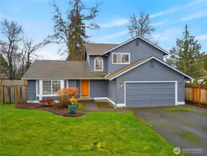Charming two-story home with fresh exterior appeal, inviting front entry, and a spacious two-car garage, set on a landscaped lot in a quiet neighborhood.