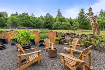 Fire pit and raised gardens.
