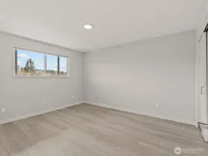 Across the hall is the large bedroom.