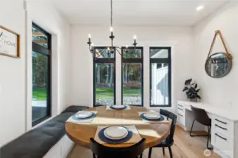 Get your day started right in the breakfast "nook". It has built-in seating, a built-in desk for homework or office work, lovely chandelier and tranquil view of the lovely backyard and covered patio.