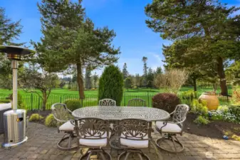 The dining area, situated just off the main dining room, is perfectly positioned along the 17th fairway, offering a front-row seat to the engaging activity of golfers as they approach the final stretch of their game.