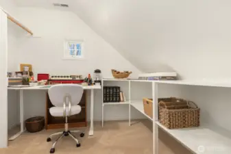 The fourth bedroom features two charming window seats and is generously sized—large enough to serve as a second primary bedroom upstairs. The spacious closet is currently being utilized as a bonus craft room, adding versatility to the space.