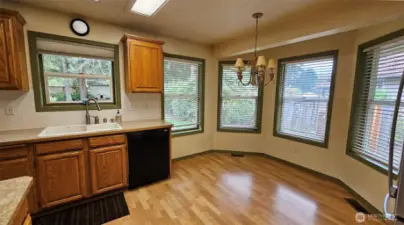 Kitchen's convenient and bright breakfast nook area with bay window architecture
