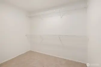 Spacious primary closet.