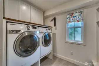 Main floor half bath/laundry - separated by a pocket door.