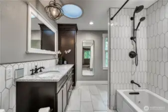 Fully updated primary bath with radiant floor heating and attached walk-in closet