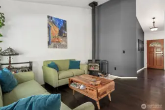 Family room off the kitchen with a wood stove for cozy nights
