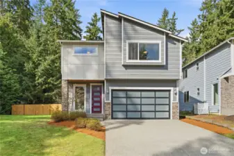 Exterior of this modern home with strong PNW design roots, set on an exceptionally large corner lot. Freshly painted and very clean, this home is ready for its new owners
