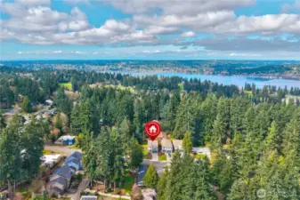 Another bird’s-eye look at the property, showcasing the wide corner lot and its open, inviting setting