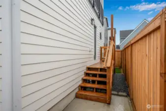 Access to private deck and yard from the main level primary suite.