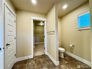 Primary Bathroom with linen & walk-in closet