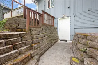 Stairs from back patio to downstairs entrance
