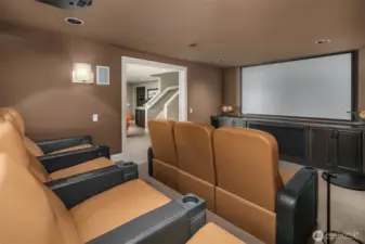 7 seat acoustically engineered media room with 110' screen and Definitive Audio designed sound.