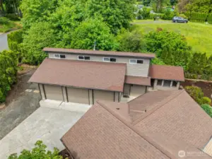 Three bay shop w/way more than meets the eye! Studio/office/loft (658 sq ft) plus shop space appx 1300 sq ft per appraisal & county record. Plus there is an attached garage on the home.  No shortage of storage & parking! Level RV parking next to shop.