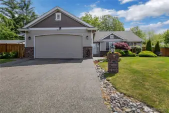 Gorgeous one level home at High Cedars Golf Course! elongated driveway, mature landscaping, luscious greenery and flowery flower beds, wow!