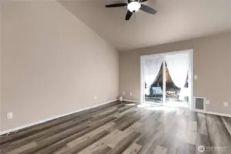 Yet another area to furnish and use! Sliding glass door leads to a large patio, mature landscaping and a way to escape!