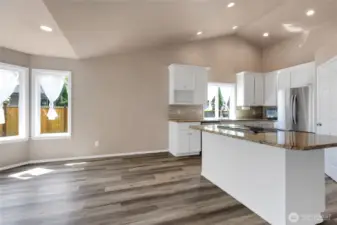 The kitchen is is huge. Wood wrapped windows, newly painted cabinets, granit counters, stainless steel appliance, huge pantry.