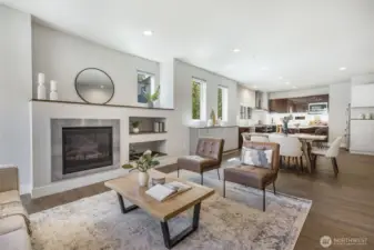 A spacious open floor plan sets the stage for entertaining, with seamless flow between kitchen, dining, and living areas designed to bring everyone together