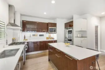 Kitchen features Ichijo’s signature piano finish cabinets with modular adjustable drawer dividers and hydraulic pull down shelf that makes reaching essentials a breeze
