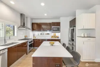 Large kitchen island is perfect for chopping, chatting, or sipping morning coffee