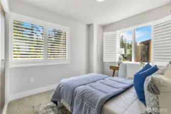 Bedroom two also has magnetic door stops and sleek Norman brand window shutters