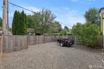 Extra parking and storage space with 12 foot gate off of Miller