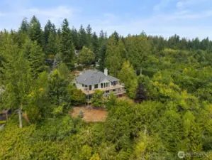 Sited on 3/4 acre, the home is surrounded by nature at it's finest; watch eagles soar and deer wander through.