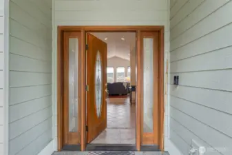 Glossy ceramic tile graces the grand entrance hallway.
