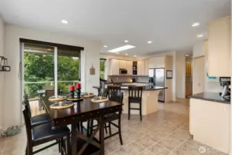 The eating nook opens onto a covered seating area on the deck, perfect for warm weather dining, and convenient to the kitchen.