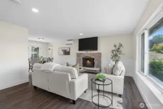Beautiful laminate planked flooring throughout the home blend each room together seamlessly while also opening up the space to feel large and airy.